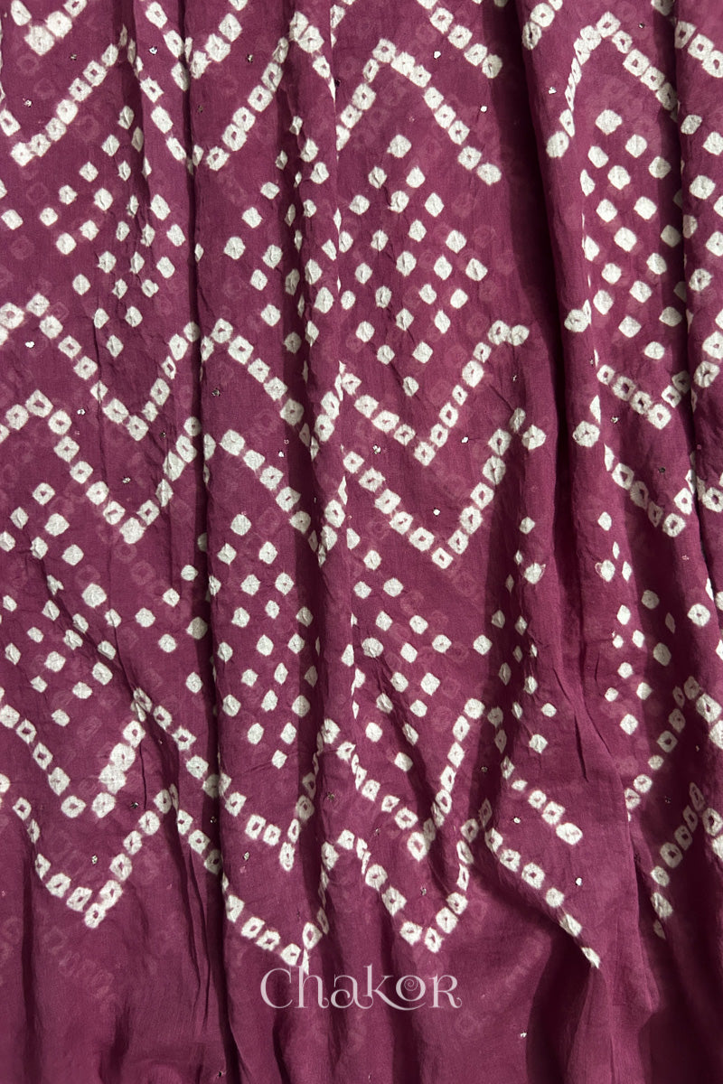 Detailed view of Bandhani tie-dye pattern and fabric fall on Plum pink cotton dupatta.
