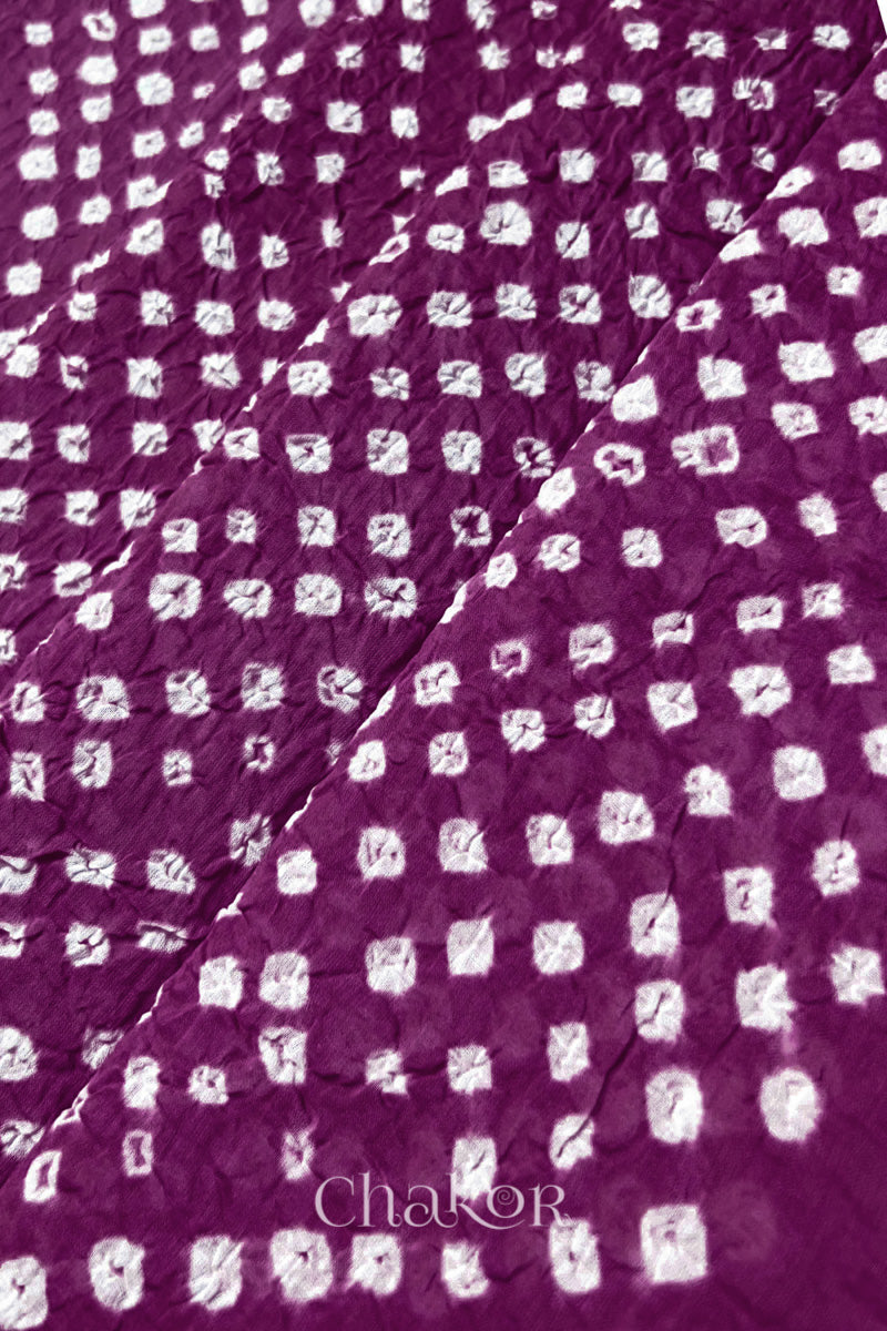 Chakor's magenta cotton dupatta with white bandhani pattern, creating a stylish visual effect.