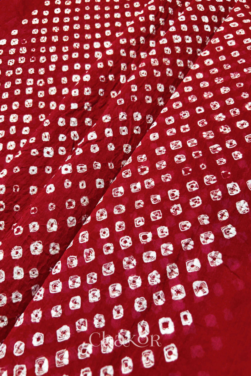 Chakor's red cotton dupatta with white bandhani pattern, creating a stylish visual effect.
