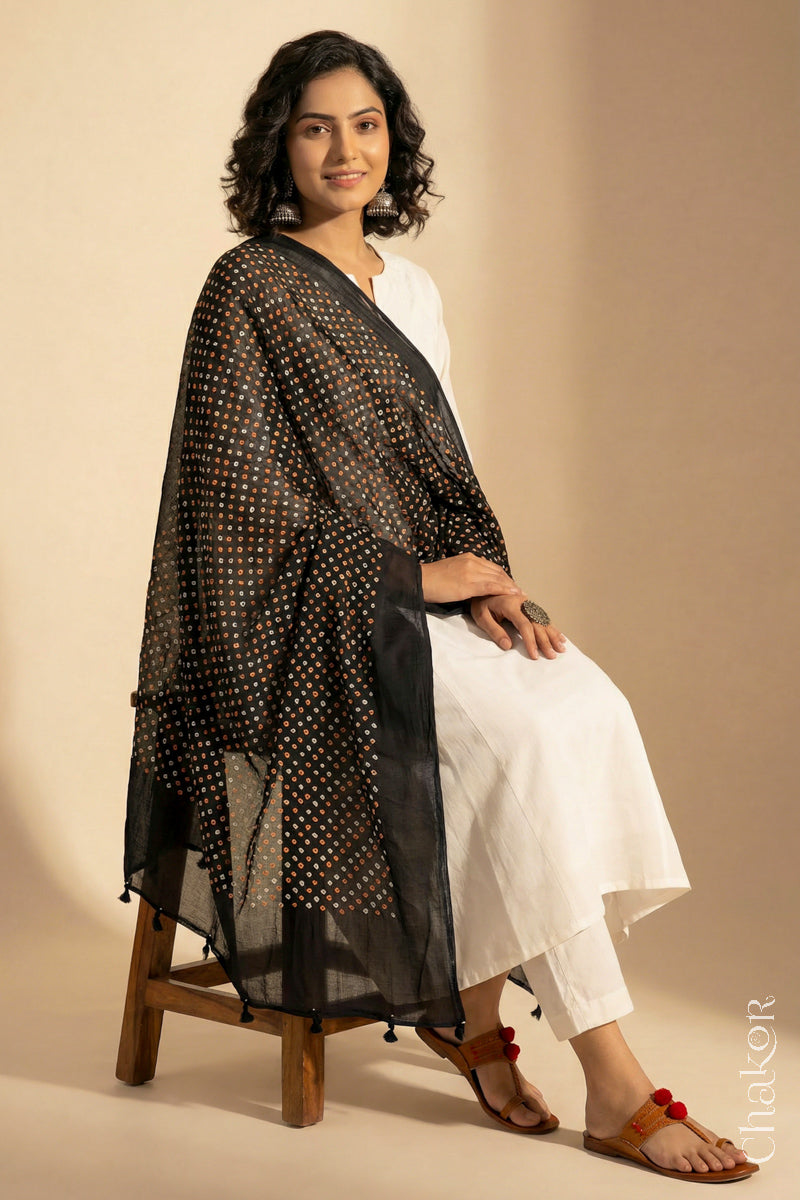 Black Mercerised Mulmul Bandhani Dupatta draped on model - CHAKOR