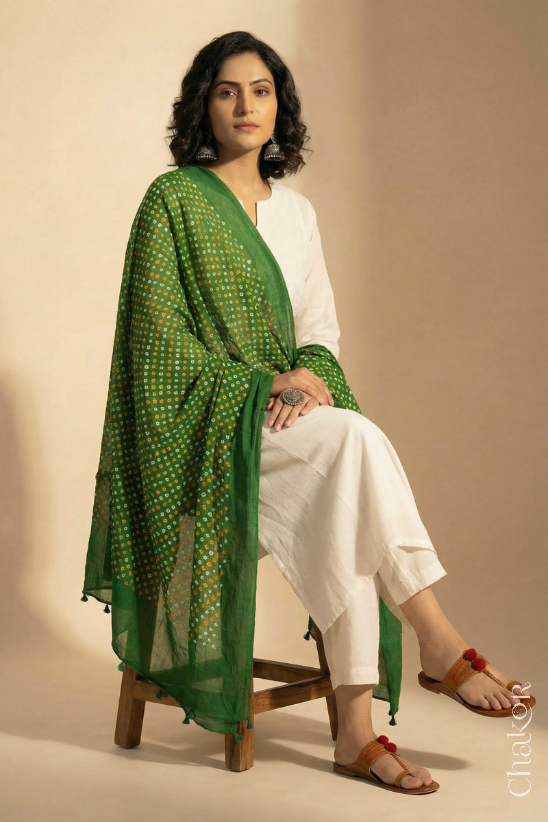 Mehendi Green Mercerised Cotton Mulmul Bandhani Dupatta, detailed with tassels draped on model - Real Bandhej by CHAKOR.