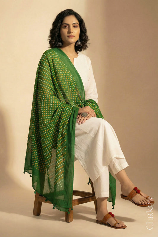 Mehendi Green Mercerised Cotton Mulmul Bandhani Dupatta, detailed with tassels draped on model - Real Bandhej by CHAKOR.