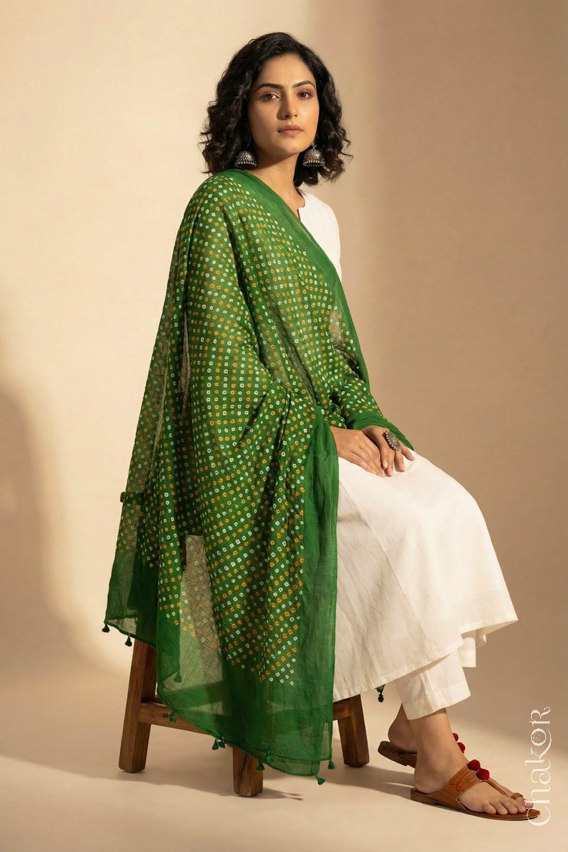 Mehendi Green Mercerised Cotton Mulmul Bandhani Dupatta, detailed with tassels draped on model - Real Bandhej by CHAKOR.