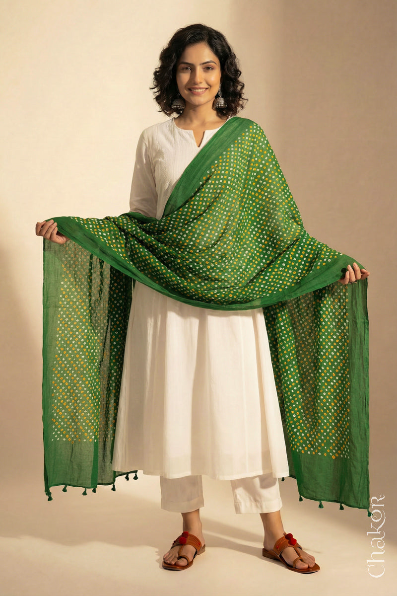 Mehendi Green Mercerised Cotton Mulmul Bandhani Dupatta, detailed with tassels draped on model - Real Bandhej by CHAKOR.
