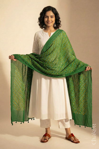 Mehendi Green Mercerised Cotton Mulmul Bandhani Dupatta, detailed with tassels draped on model - Real Bandhej by CHAKOR.
