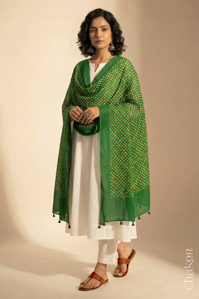 Mehendi Green Mercerised Cotton Mulmul Bandhani Dupatta, detailed with tassels draped on model - Real Bandhej by CHAKOR.