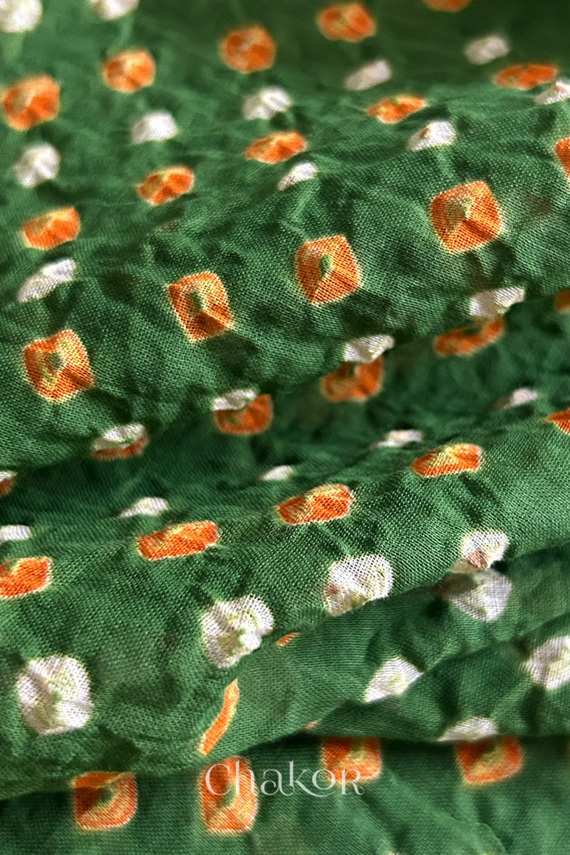 Close up of Handcrafted Mehendi Green Bandhani dupatta featuring dense white and orange tie-dye dot pattern by CHAKOR.