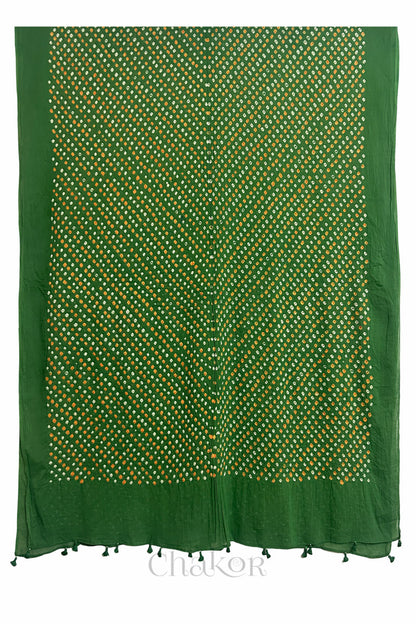 Full length view of intricate white and orange Bandhani dot pattern on Mehendi Green Mulmul cotton fabric by CHAKOR.