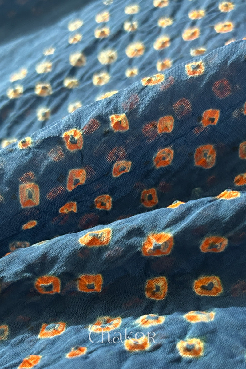 Close up of Handcrafted Indigo Blue Bandhani dupatta featuring dense white and orange tie-dye dot pattern by CHAKOR.