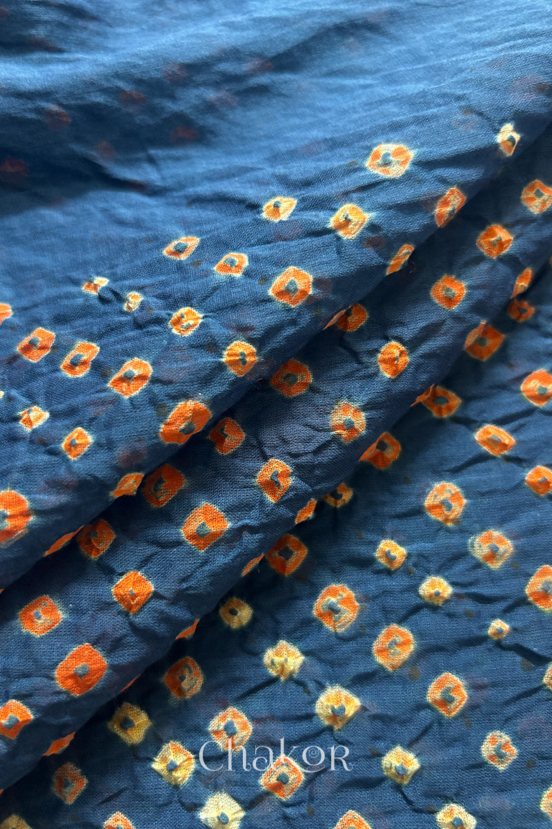 Close up of Handcrafted Indigo Blue Bandhani dupatta featuring dense white and orange tie-dye dot pattern by CHAKOR.