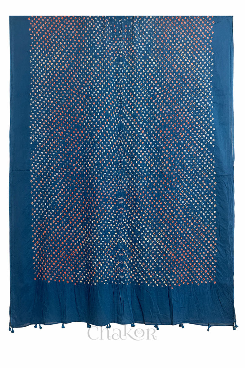 Full length view of intricate white and orange Kutch Bandhani dot pattern on Indigo Blue Mulmul cotton fabric by CHAKOR.