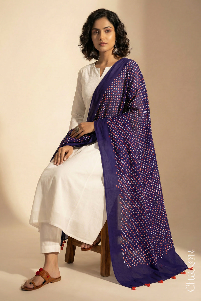 Purple Mercerised Cotton Mulmul Bandhani Dupatta, detailed with tassels draped on model - Real Bandhej by CHAKOR.