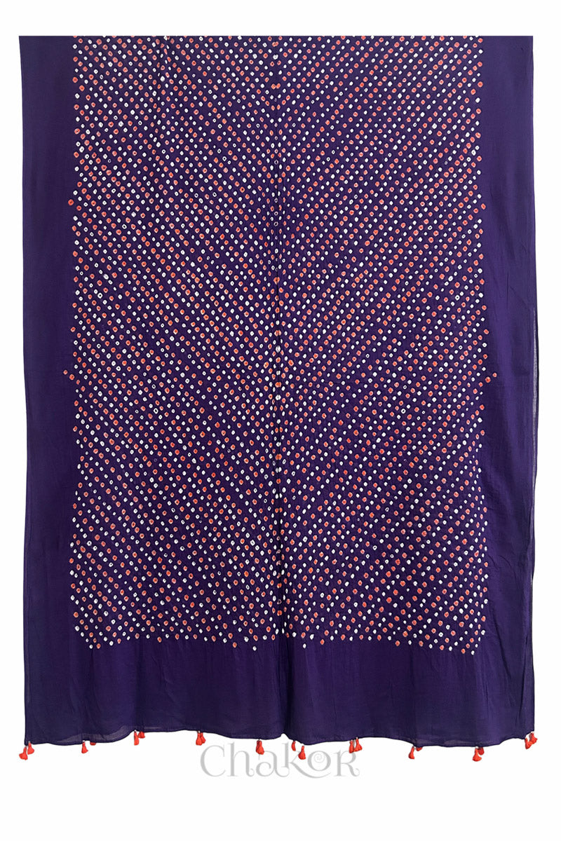 Full length view of intricate white and orange Bandhani dot pattern on Purple Mulmul cotton scarf dupatta by CHAKOR.