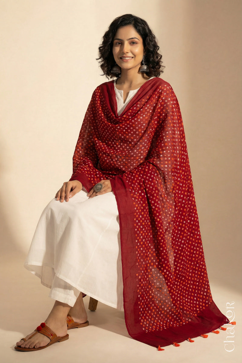 Red Mercerised Mulmul Bandhani Dupatta draped on model - Real Bandhej by CHAKOR
