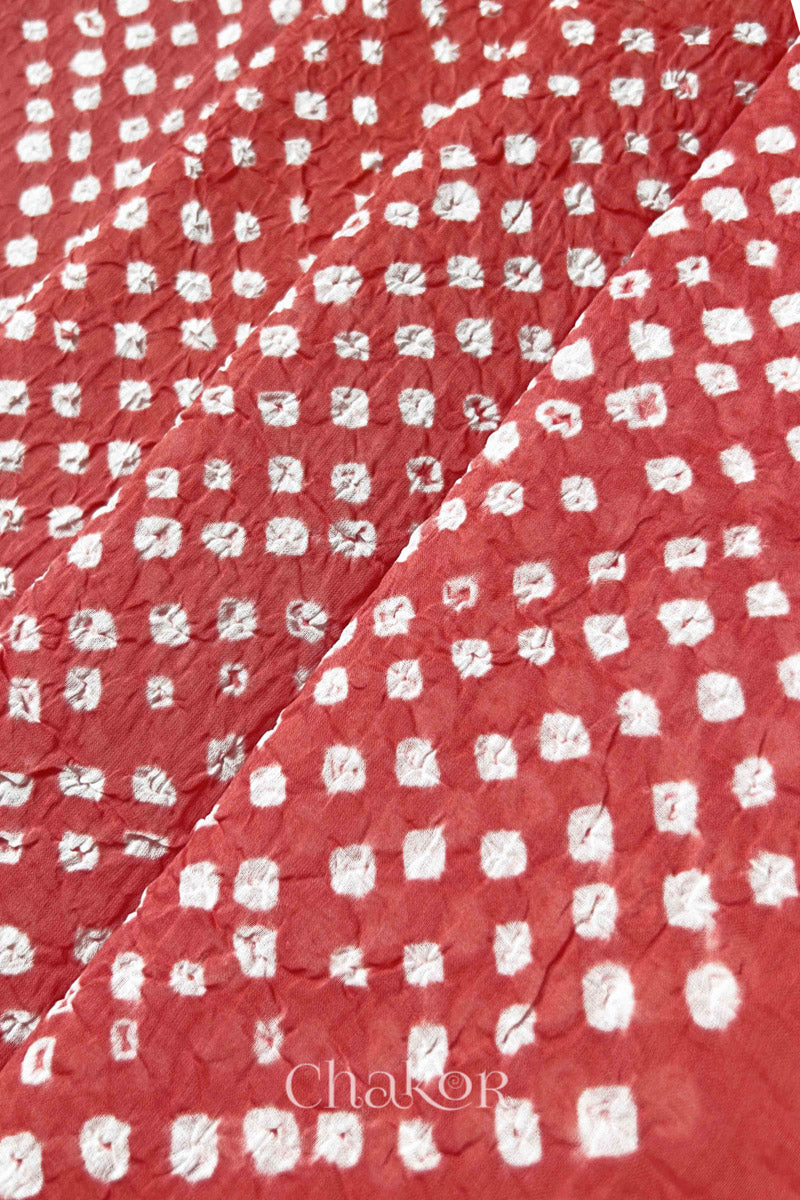 Close-up of Dusty Red Bandhani tie-dye dot pattern on mul cotton dupatta.