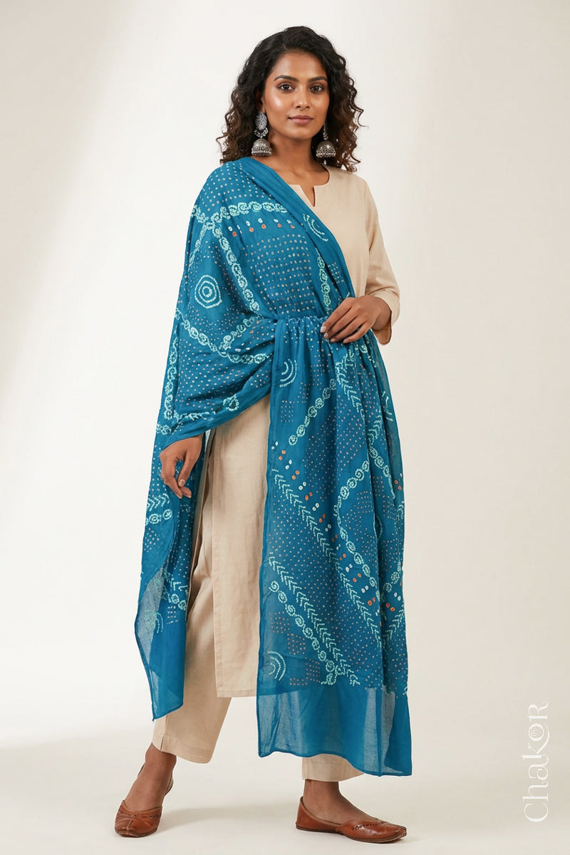 Model wearing Turquoise Bandhani Mul Cotton Dupatta with traditional design handcrafted in Kutch, Gujarat.