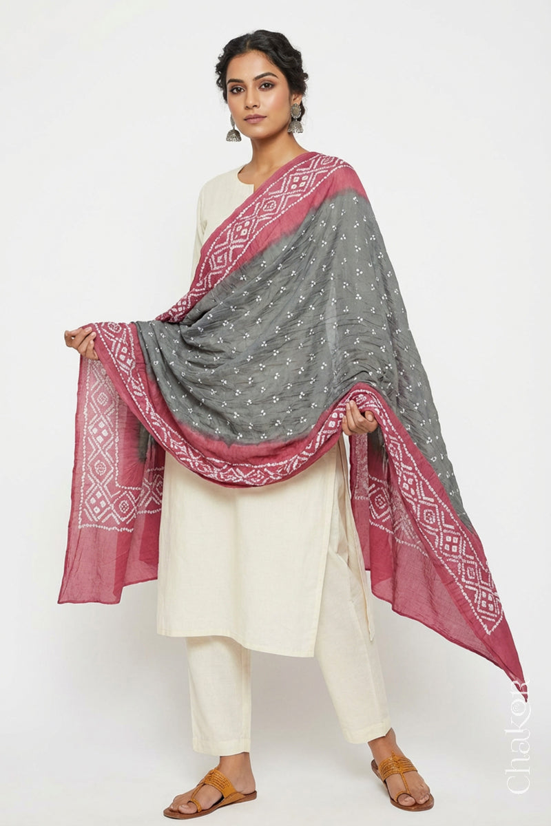 Model wearing Cement Grey & Rose Pink Bandhani Mul Cotton Dupatta in Traditional Design on white kurta set.