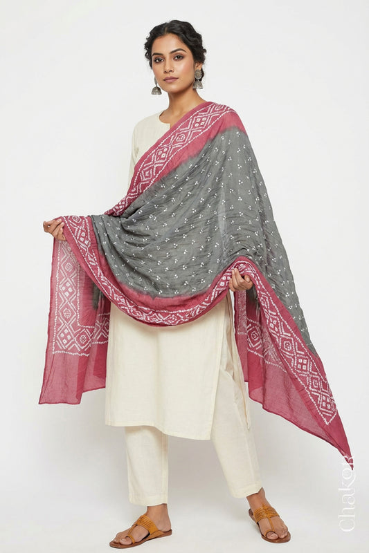 Model wearing Cement Grey & Rose Pink Bandhani Mul Cotton Dupatta in Traditional Design on white kurta set.