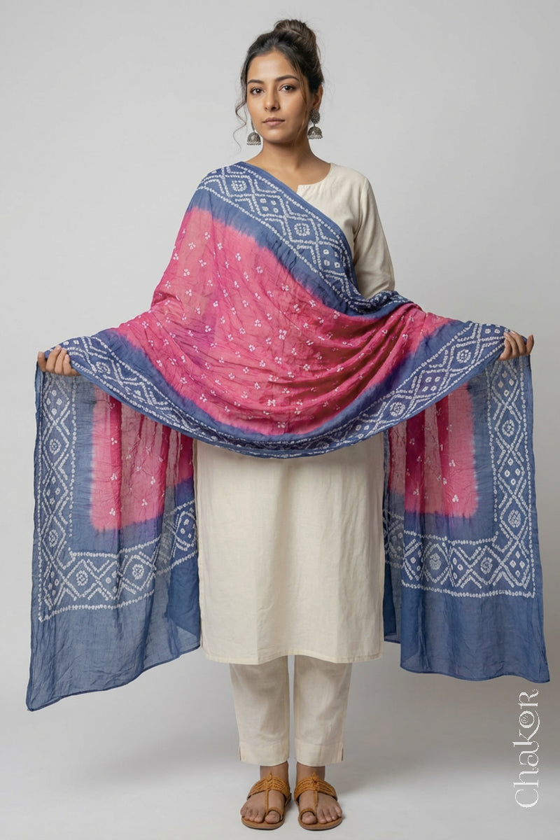 Model wearing Pink Grey Bandhani Mul Cotton Dupatta in Traditional Design on offwhite kurta set.