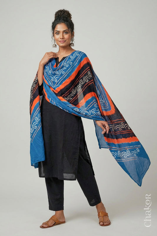 Model wearing black indigo mul cotton Bandhani dupatta with multicolour tie-dye dots and striped bands draped over a black kurta.