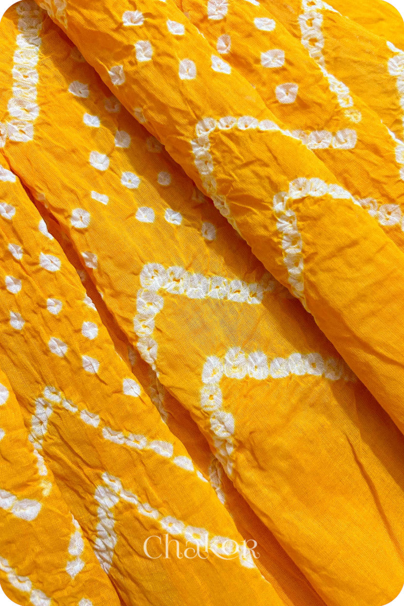 Yellow Bandhani Mul Cotton Dupatta for Women's clothing online by Chakor.Traditional Yellow Bandhani Mul Cotton Dupatta for Women's clothing online by Chakor.