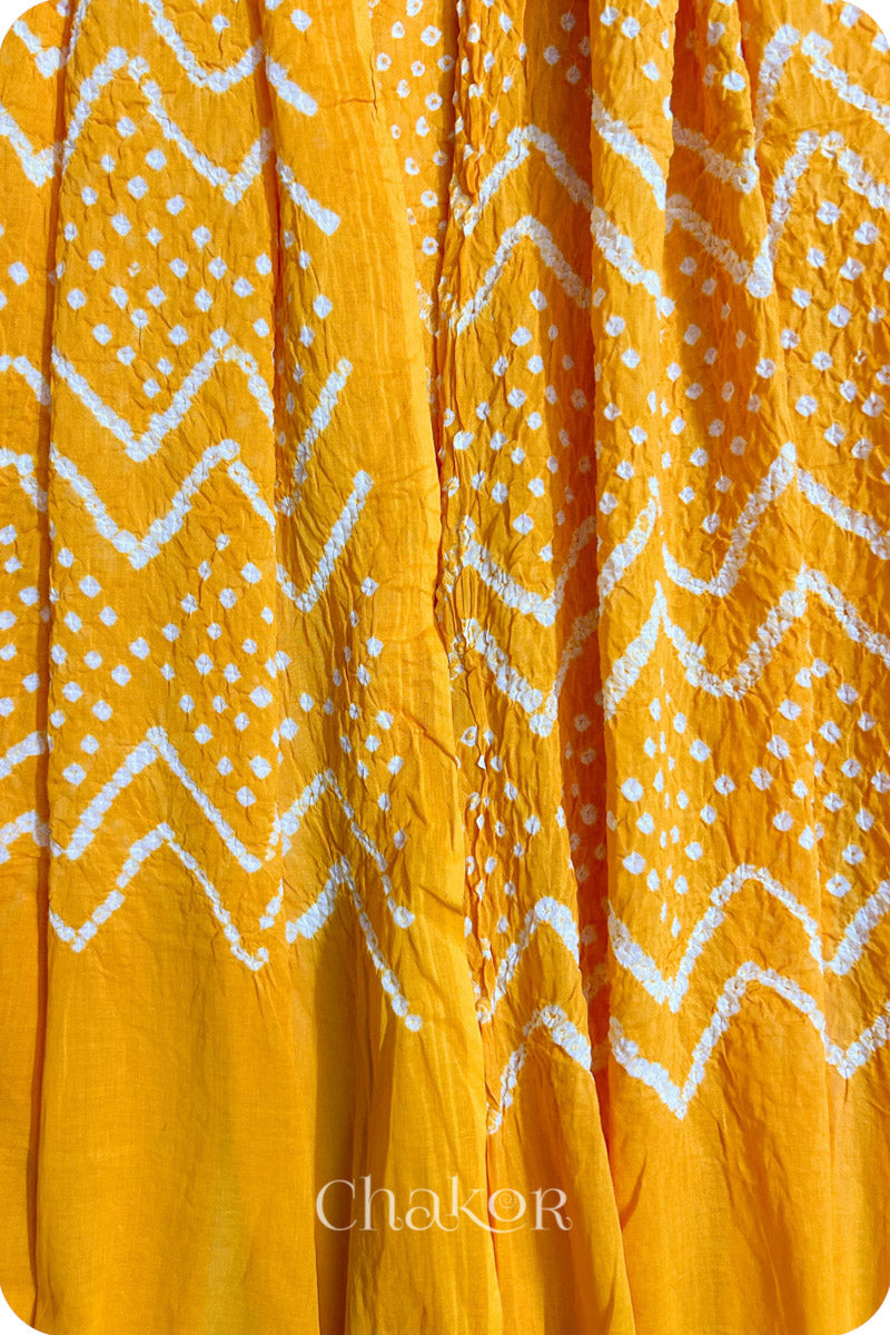 Yellow Bandhani Mul Cotton Dupatta for Women's clothing online by Chakor.Traditional Yellow Bandhani Mul Cotton Dupatta for Women's clothing online by Chakor.