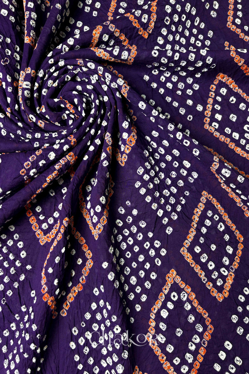 Fabric swirl close-up of Purple Bandhani Mul Cotton Dupatta highlighting dense tie-dye work  by Chakor.
