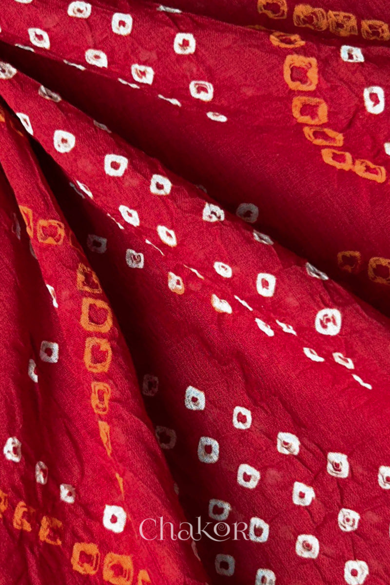 Close-up of Bandhani tie-dye details on Maroon Mul Cotton Dupatta with white and yellow dot patterns by Chakor.
