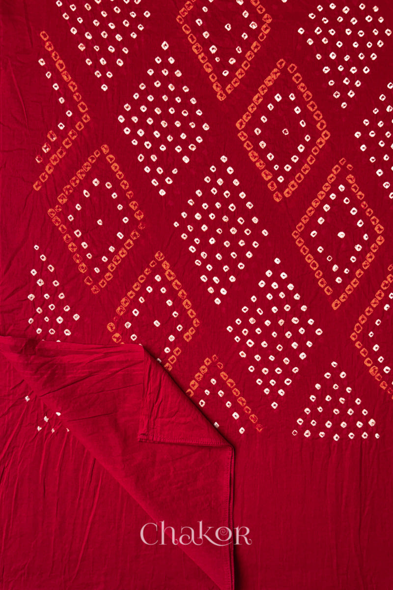 Flatlay of Red Bandhani Mul Cotton Dupatta with Chorkat diamond layout and border view  by Chakor.