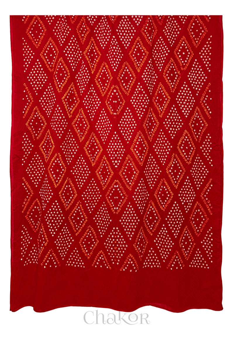 Full spread of Tomato Red Mul Cotton Bandhani Dupatta showcasing overall diamond pattern by Chakor.