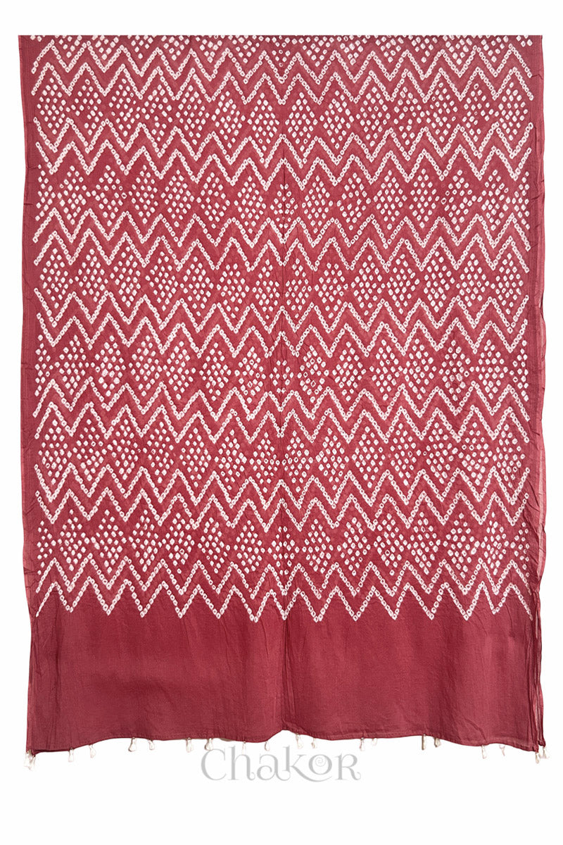 Full view of Dusty red Kutch Bandhani dupatta in pure mercerised mulmul cotton.
