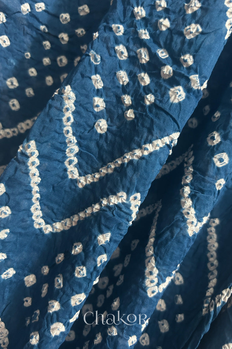 Close up of Traditional hand tied Bandhani pattern on Indigo Blue mulmul cotton dupatta.
