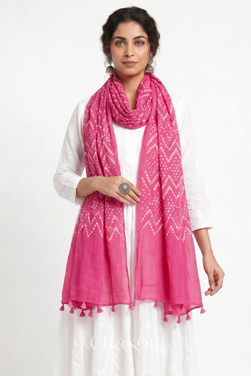 Hand tied Pink Kutch Bandhani dupatta in pure mercerised mulmul cotton worn by model.
