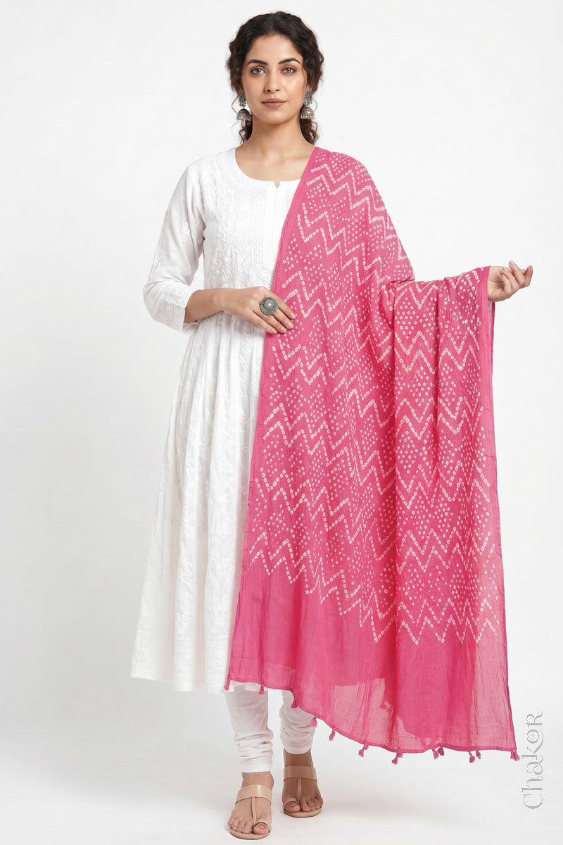 Pink Kutch Bandhani dupatta in lightweight mercerised mulmul cotton with flowing drape.
