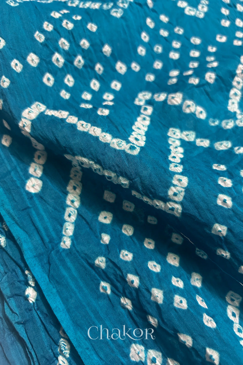 Close up of Traditional hand tied Bandhani pattern on Turquoise Blue mulmul cotton dupatta.
