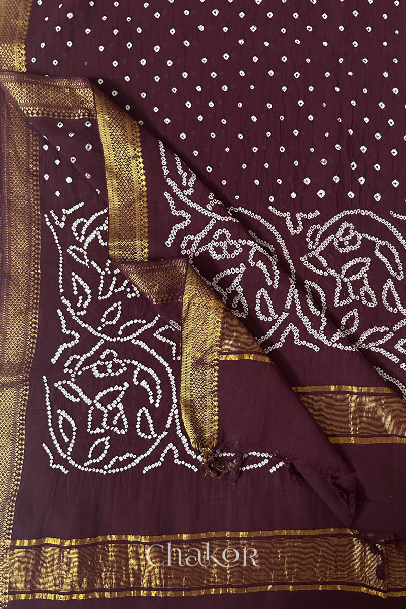 Maroon Bandhani Mangalgiri cotton dupatta flat view, showing the patterned pallu and golden zari detailing.
