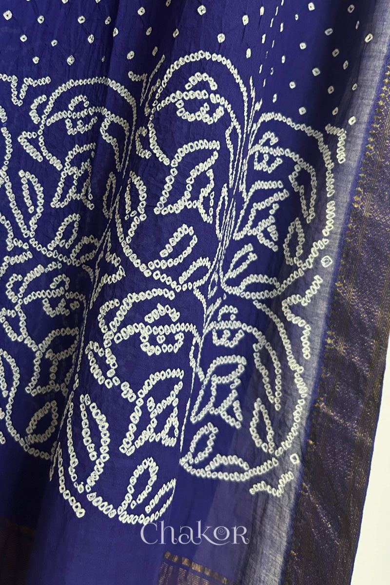 Close-up of Navy blue Mangalgiri cotton fabric showing its handloom weave and opacity.
