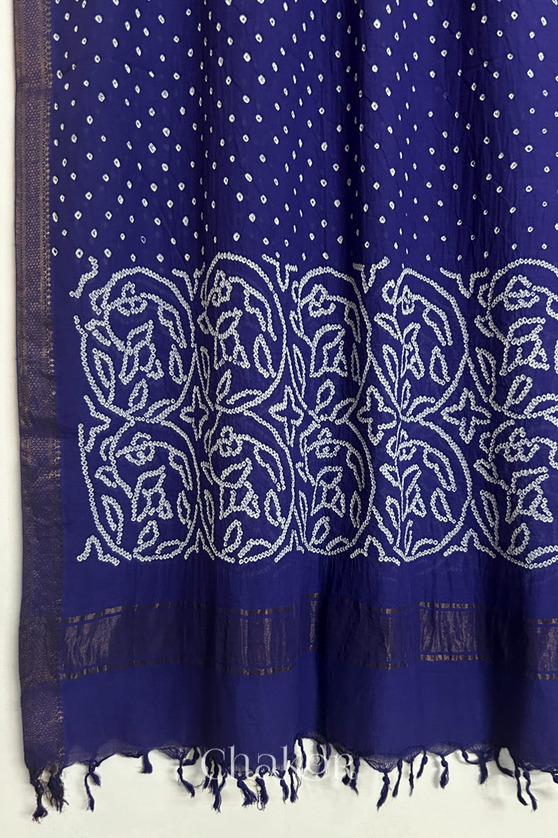Navy blue Bandhani Mangalgiri cotton dupatta, showing the draped of patterned pallu, golden zari detailing and tassels.
