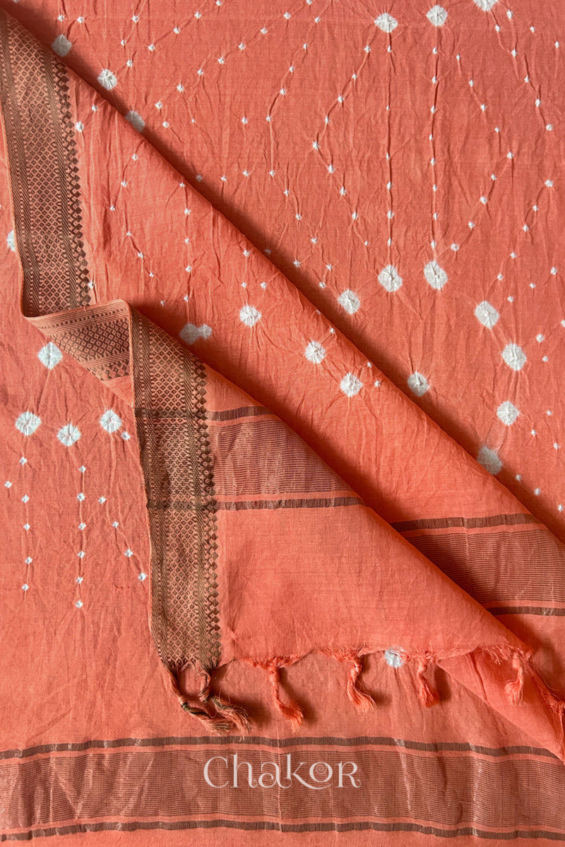 Peach Bandhani Mangalgiri cotton dupatta flat view, showing the patterned pallu and golden zari detailing.
