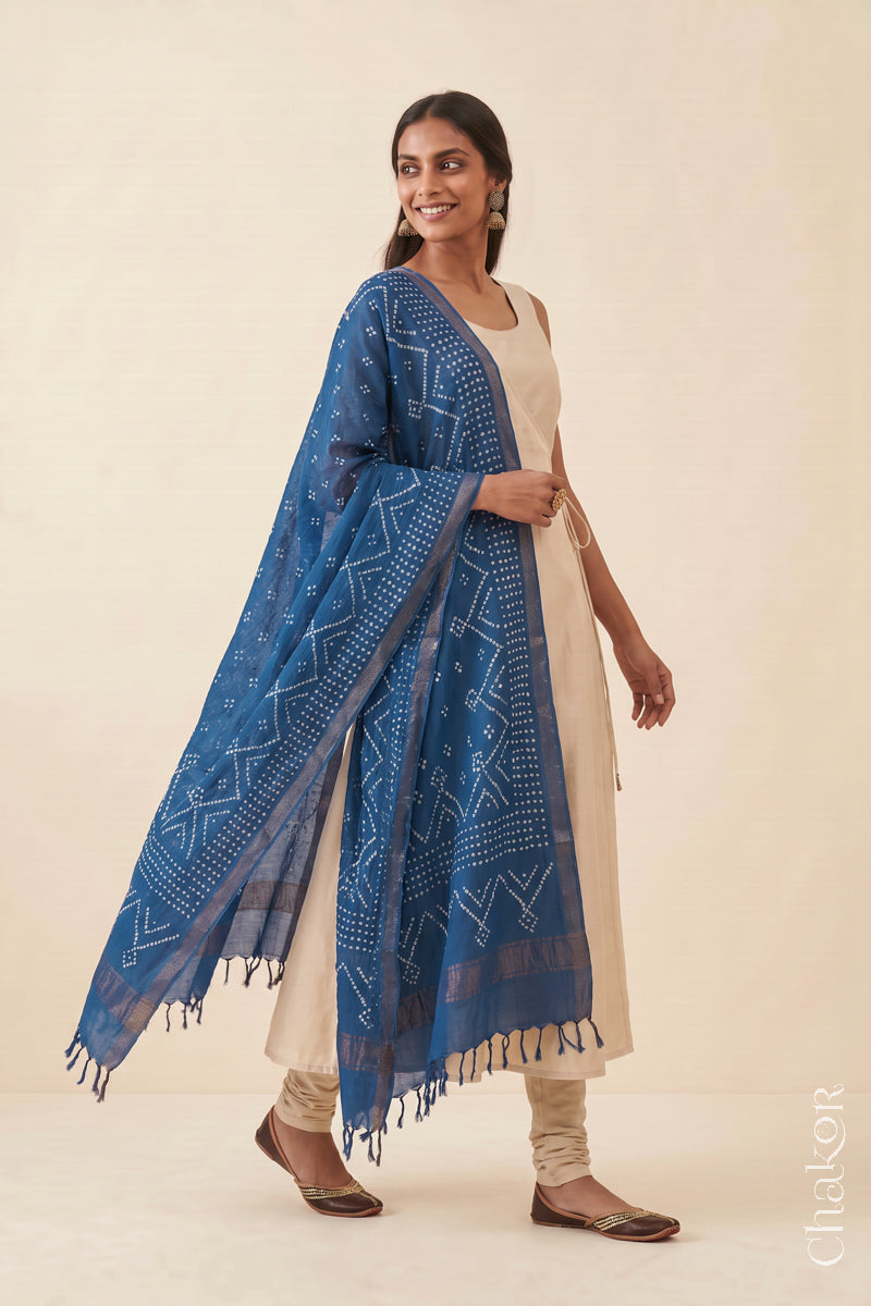 Indigo Blue Bandhani Mangalgiri cotton dupatta worn by a woman, showing the zari border and pallu.
