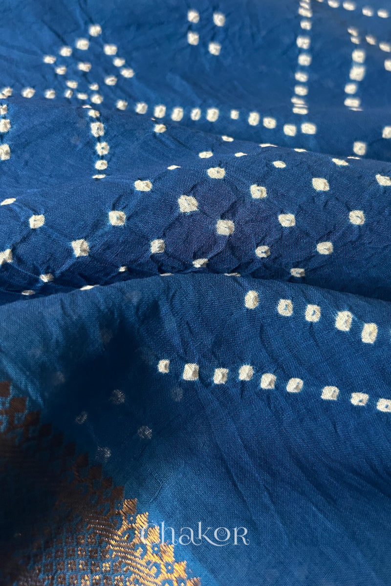 Close-up of white pearl-like dots in the Indigo Blue Kutch Bandhani tie-dye pattern.
