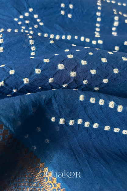 Close-up of white pearl-like dots in the Indigo Blue Kutch Bandhani tie-dye pattern.

