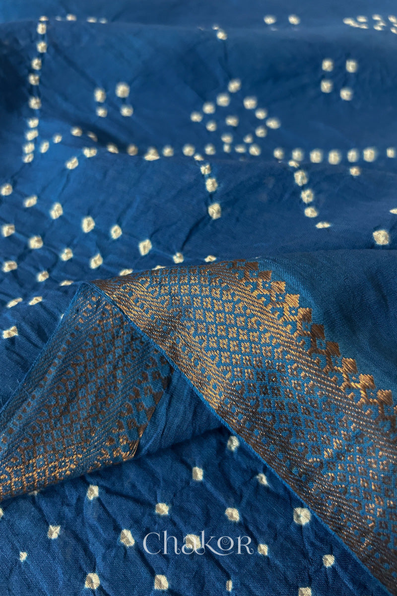 Close-up of the golden zari border on Indigo Blue handloom Mangalgiri cotton Bandhani dupatta.
