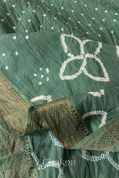 Close-up of white pearl-like dots in the Moss Green Kutch Bandhani tie-dye pattern.
