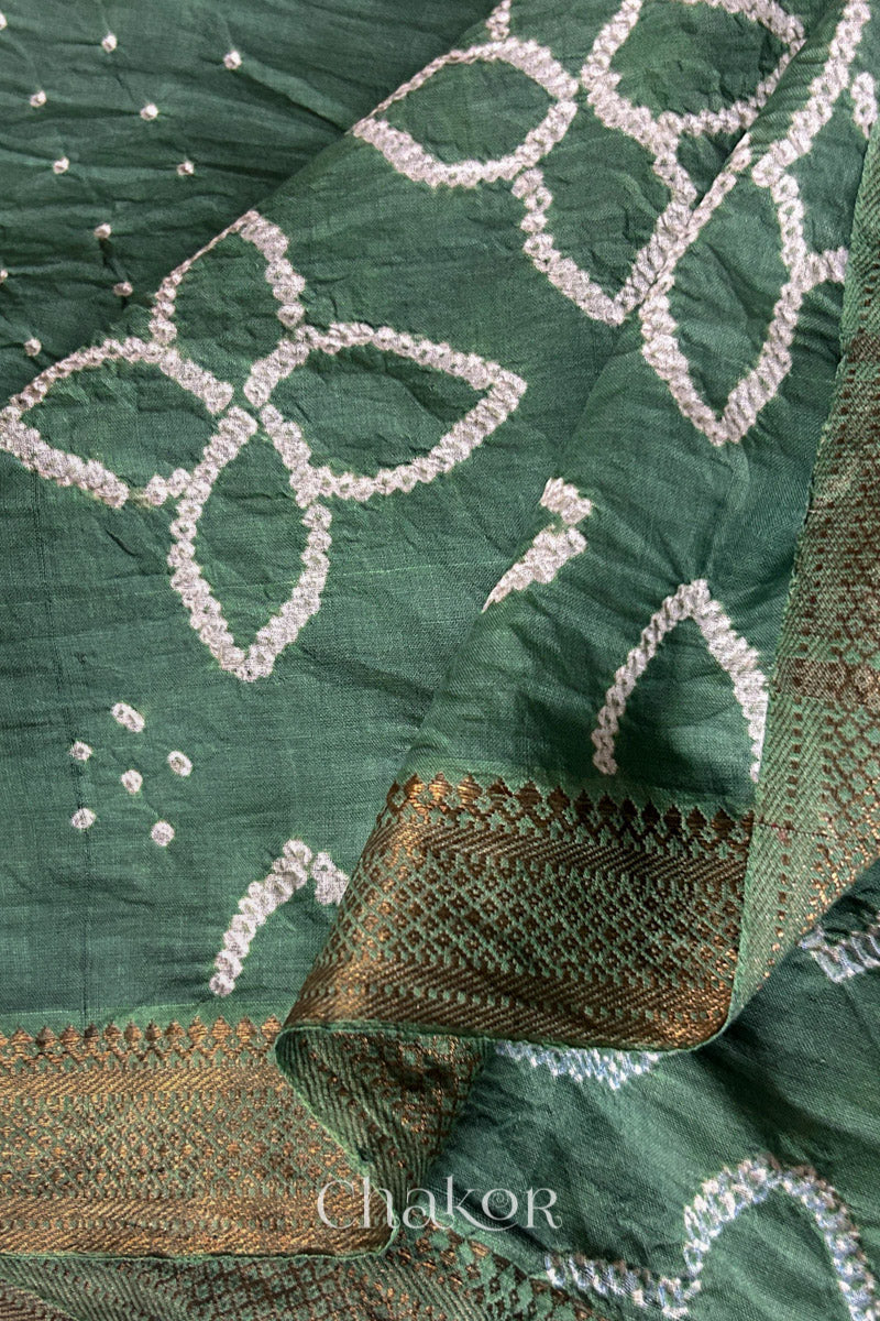 Close-up of the golden zari border on Moss Green handloom Mangalgiri cotton Bandhani dupatta.
