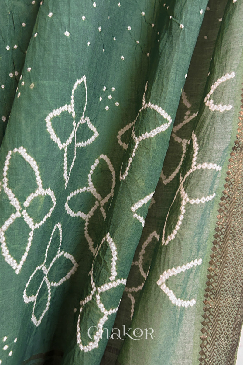 Close-up of Moss Green Mangalgiri cotton fabric showing its handloom weave and opacity.
