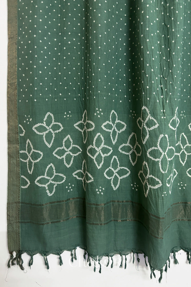 Moss Green Bandhani Mangalgiri cotton dupatta, showing the draped of patterned pallu, golden zari detailing and tassels.
