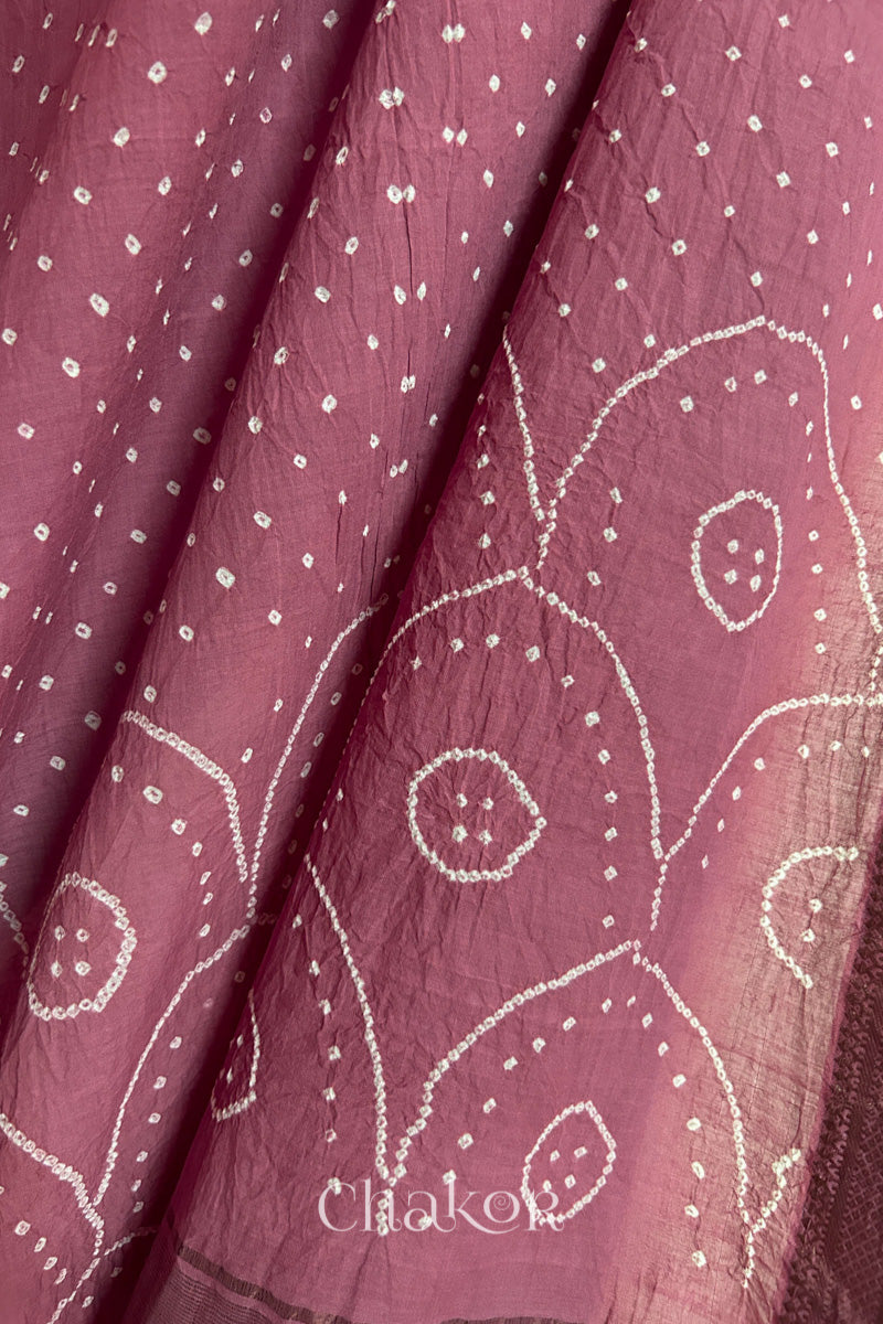 Close-up of Old Rose Pink Mangalgiri cotton fabric showing its handloom weave and opacity.
