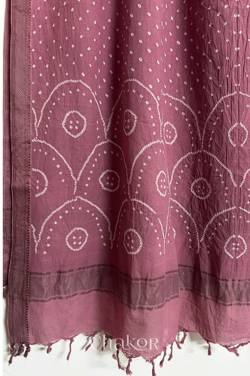 Old Rose Pink Bandhani Mangalgiri cotton dupatta, showing the draped of patterned pallu, golden zari detailing and tassels.
