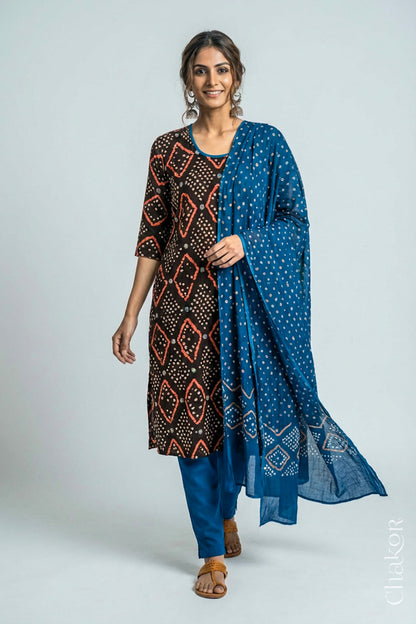 Model wearing Handcrafted Blue Bandhani Cotton Kurta and Indigo Blue Pant Set with Dupatta with traditional design and hand embroidery.